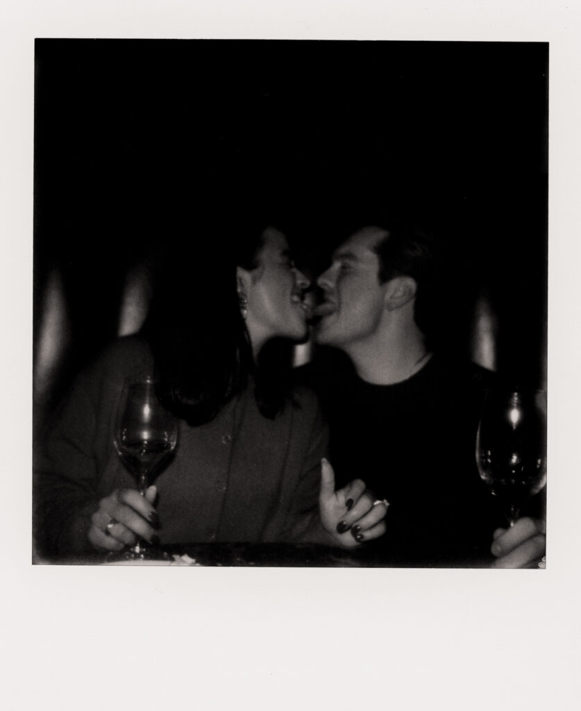 polaroid photo of couple being cute during engagement photos