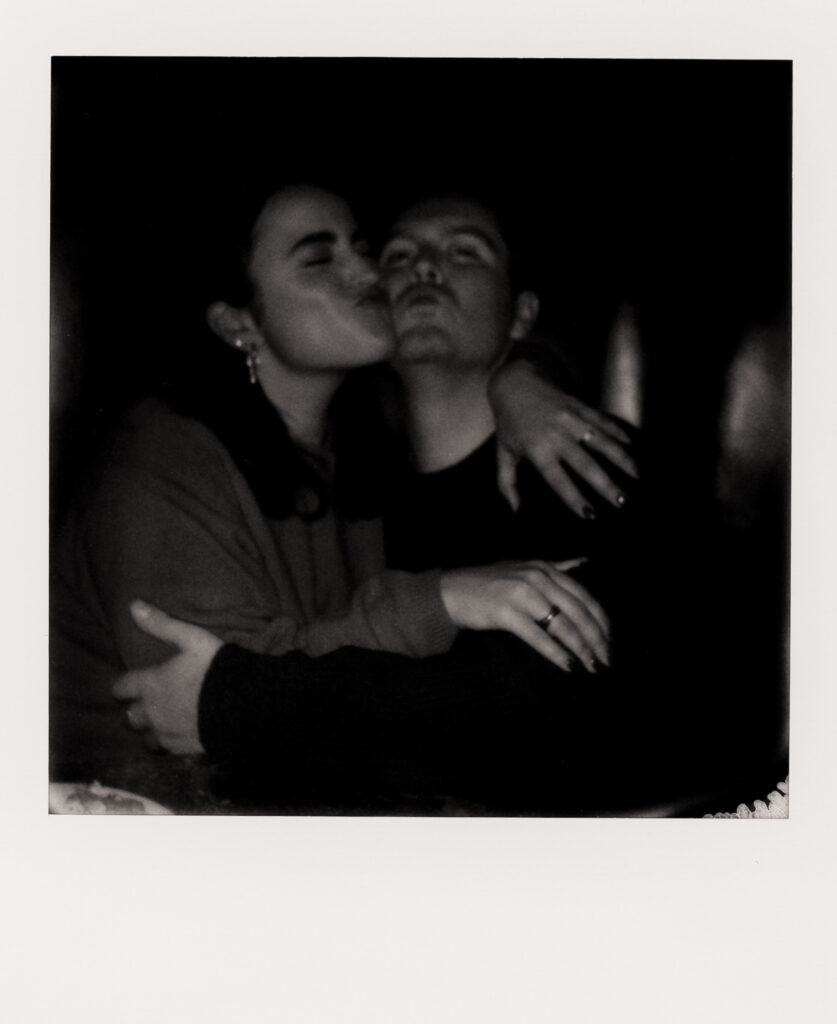 polaroid photo of couple being cute during engagement photos