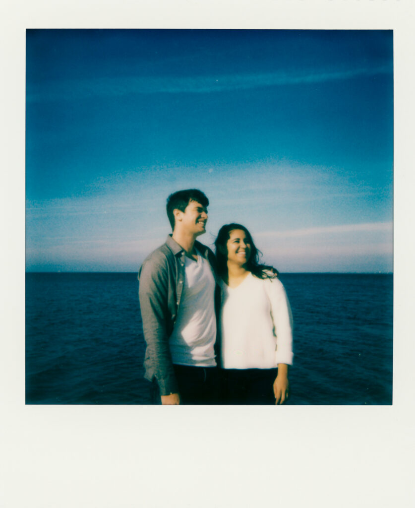 polaroid photo of couple on the beach